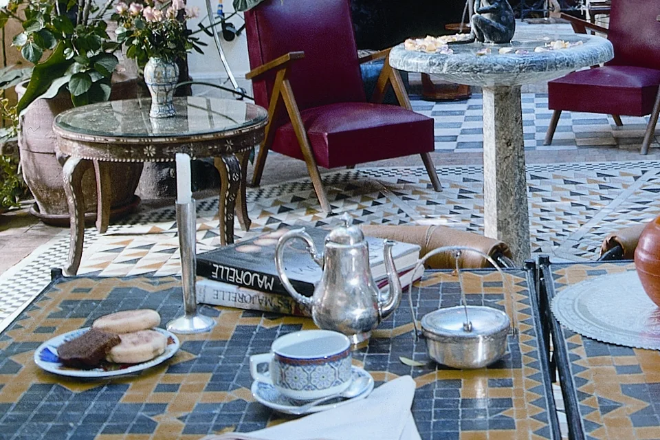 Tea served in the courtyard of Riad Malika, silver teapot and pastries